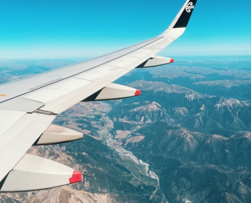 view out airplane window of wing of the plane