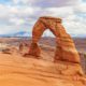 the delicate arch with the la sal mountains behind it. this trail is one of the most popular for hiking in arches national park.