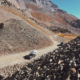 Truck camper parked at the summit of Ophir Pass Colorado showing 4WD vehicle requirements