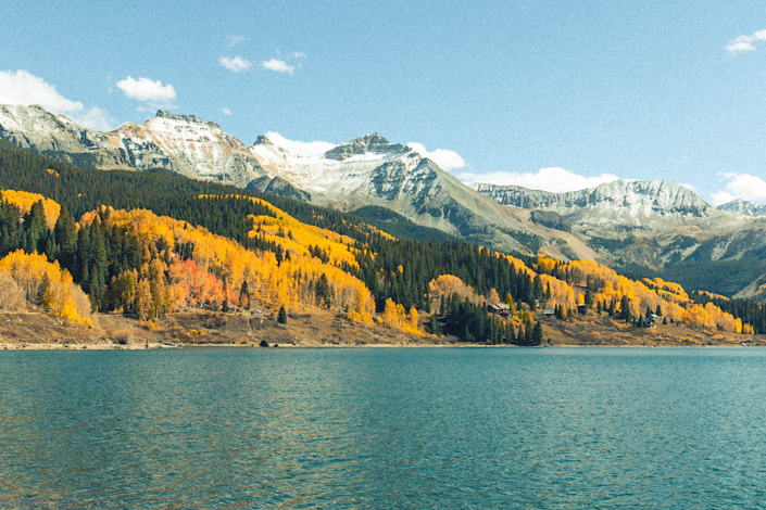 trout-lake-colorado-fall-aspens-san-juan-mountains Trout Lake Colorado with golden aspens along the shore and San Juan Mountains in the background near Ophir Pass