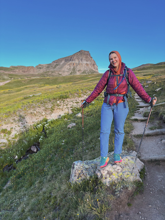 Emma hiking 14ers with Uncompahgre Peak in the background in the San Juan Mountains of Colorado