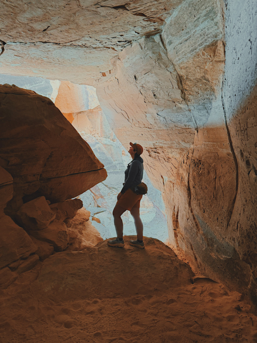 Silhouette inside a rock alcove in the Doll House area of the Maze in Canyonlands highlighting unique desert formations
