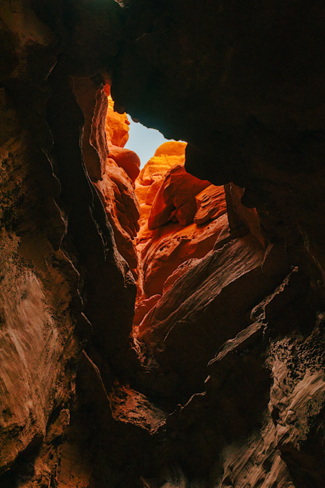 Looking up from inside Goblin’s Lair at a hole in the ceiling in Goblin Valley Utah