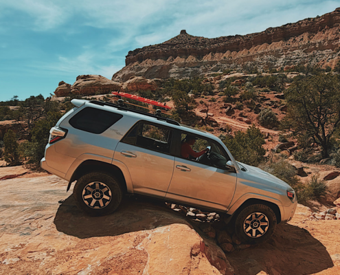 Driving a 4Runner over the Teapot in the Maze in Canyonlands, showing the difficult 4WD terrain and obstacles