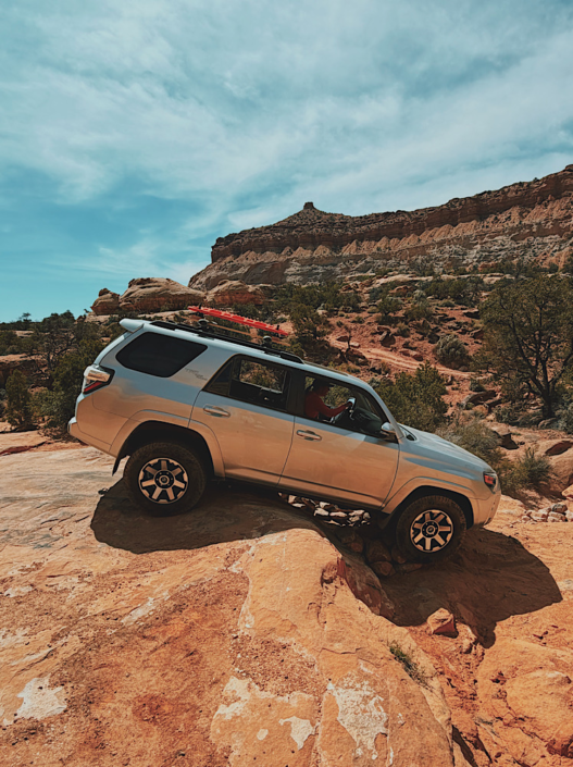 Driving a 4Runner over the Teapot in the Maze in Canyonlands, showing the difficult 4WD terrain and obstacles
