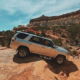 Driving a 4Runner over the Teapot in the Maze in Canyonlands, showing the difficult 4WD terrain and obstacles
