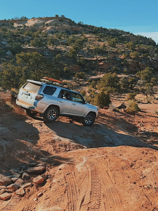 Toyota 4Runner descending a steep rocky road while driving through the Maze Utah backcountry