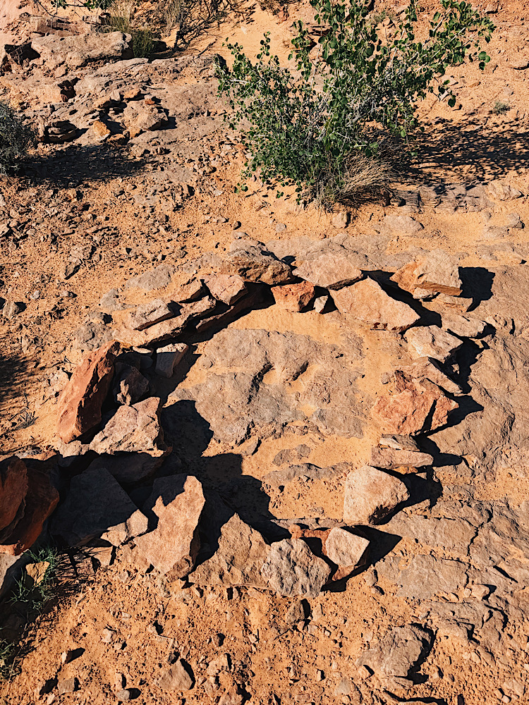 Dinosaur footprint marked by rocks along the Horseshoe Canyon hiking trail in Canyonlands National Park