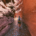 Hiking through the narrowest section of Mary Jane Slot Canyon in Utah with shallow water flowing through the slot canyon