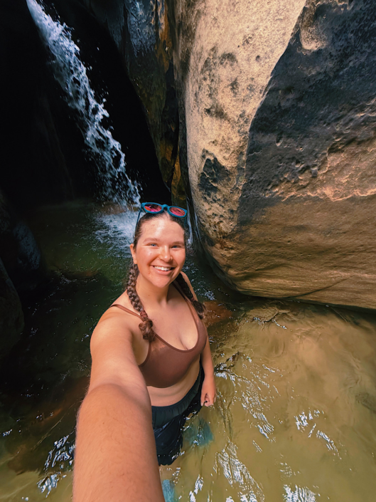 Selfie in front of the waterfall inside The Subway hike in Zion National Park
