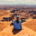 Hiker overlooking the White Rim from White Rim Overlook in Canyonlands National Park.