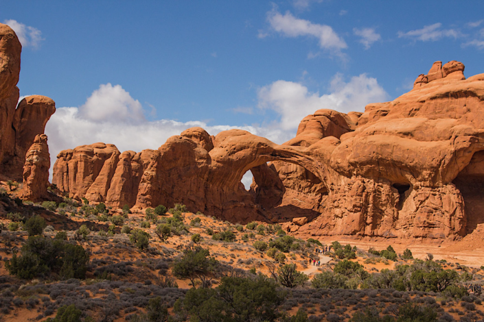 double-arch-view-from-road-arches-national-park Double Arch viewed from the park road in Arches National Park, showcasing the easy roadside attractions in an Arches National Park vs Canyonlands guide