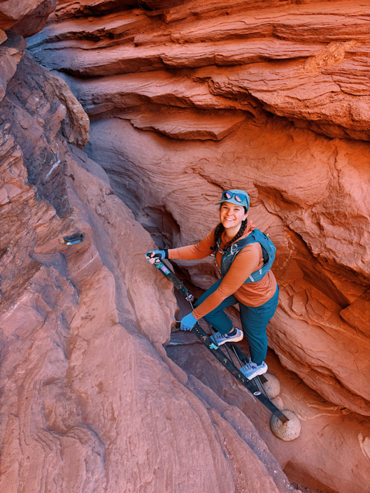 Climbing the ladder on the Fisher Towers Trail near Moab, Utah