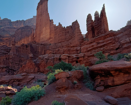 Fisher Towers Trail near Moab, Utah with the red rock towers backlit by the morning sun