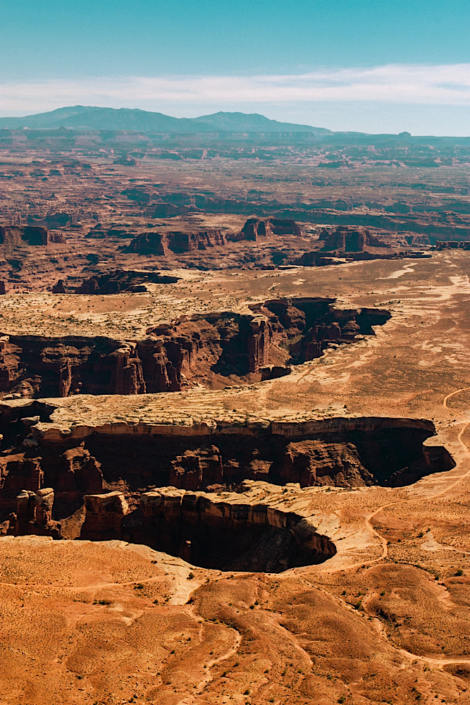 grand-view-point-trail-canyonlands-la-sal-mountains View from Grand View Point Trail in Canyonlands National Park with the La Sal Mountains, highlighting the landscapes in an Arches National Park vs Canyonlands comparison