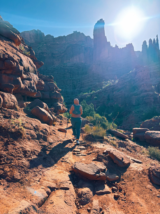 Hiking the Fisher Towers Trail with towering red rock formations near Moab, Utah
