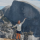 Hiker on the North Dome trail with Half Dome in the background, Yosemite National Park