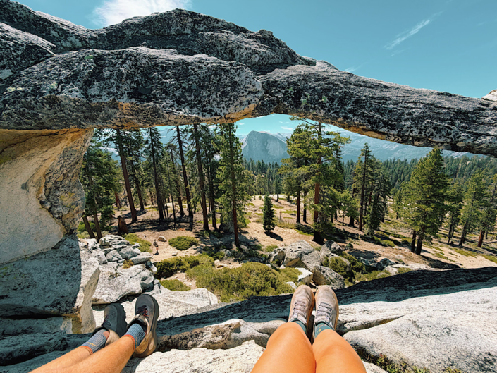 Half Dome framed through Indian Rock arch in Yosemite National Park