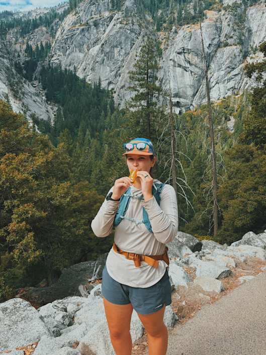 Hiker eating a Spring Energy gel during a hike