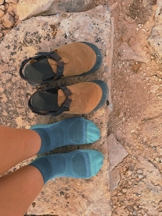 Blue Darn Tough merino wool hiking socks worn with hiking clogs on a desert hike