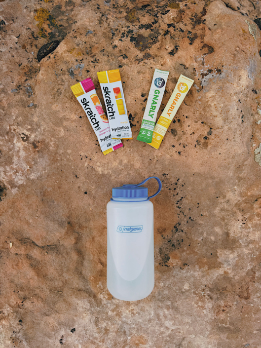Skratch Labs and Gnarly electrolyte packets with a water bottle for hiking