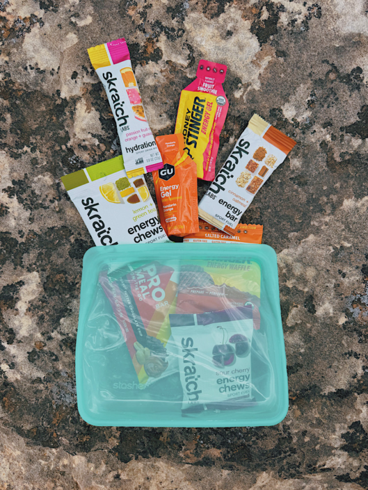 Hiking snacks, energy chews, gels, and hydration packets with a reusable Stasher bag