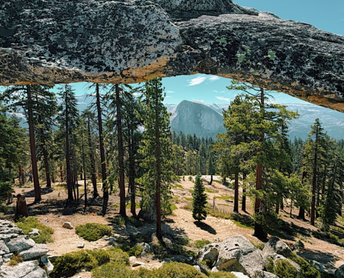 Half Dome framed through Indian Rock Arch on the North Dome Yosemite hike