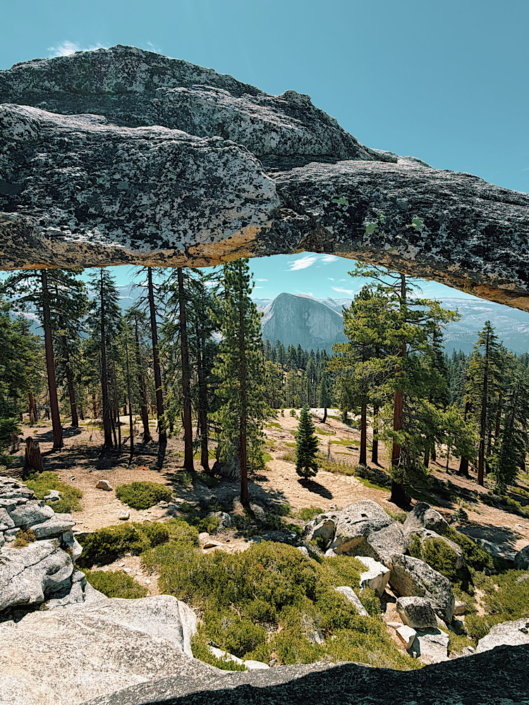 Half Dome framed through Indian Rock Arch on the North Dome Yosemite hike