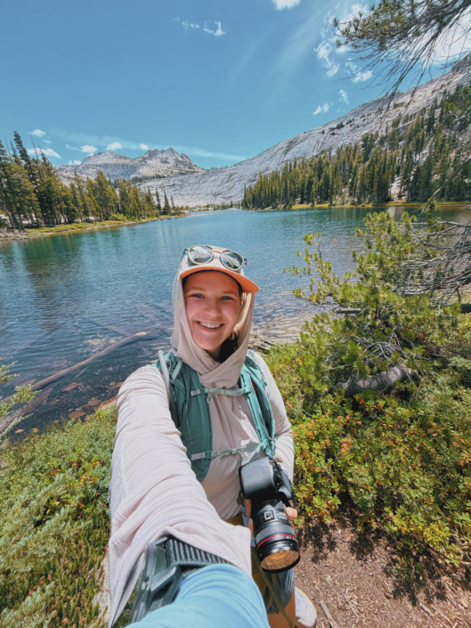 Hiker at Lower Cathedral Lake with Cathedral Peak in Yosemite