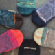 Collection of Darn Tough and Smartwool merino wool hiking socks in different weights and styles