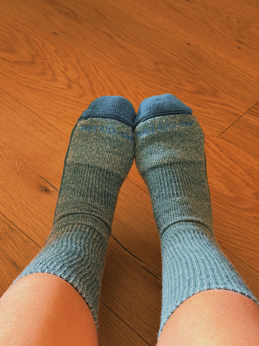 Close-up of REI merino wool hiking socks worn on feet