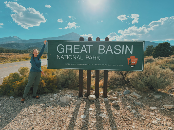 Great Basin National Park entrance sign with mountains and desert landscape in eastern Nevada