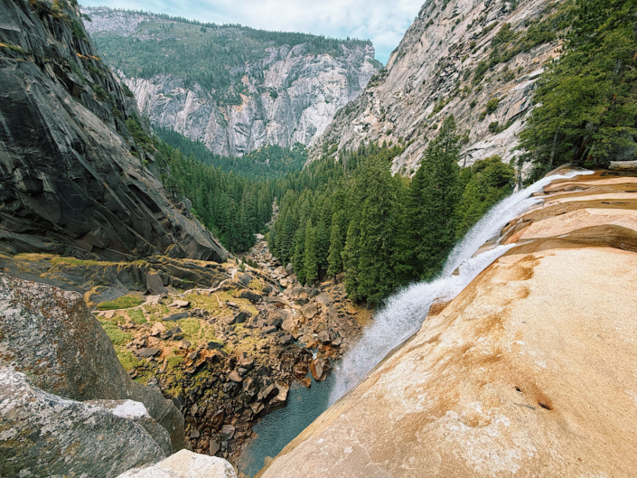 View from the top of Vernal Fall looking down toward the Mist Trail and Yosemite Valley