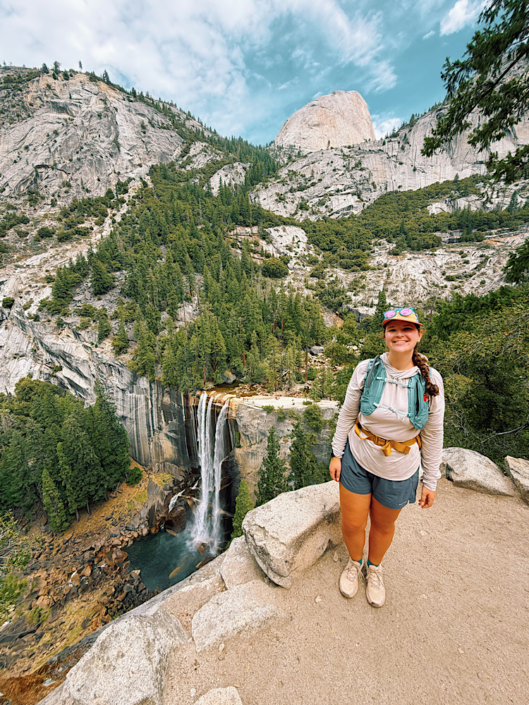 Hiker overlooking Vernal Fall on the Vernal and Nevada Falls hike in Yosemite