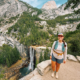 Hiker overlooking Vernal Fall on the Vernal and Nevada Falls hike in Yosemite