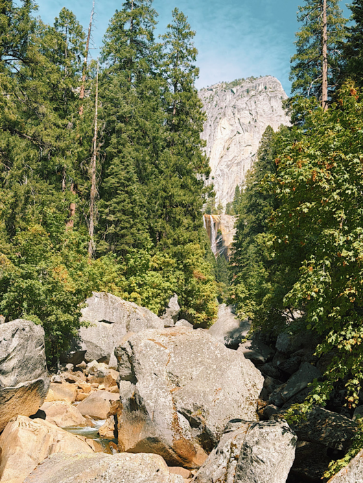 View of Vernal Fall through the trees from the Vernal Fall Footbridge in Yosemite