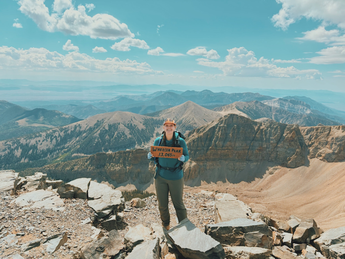 Hiker at the 13,065-foot Wheeler Peak summit in Great Basin National Park